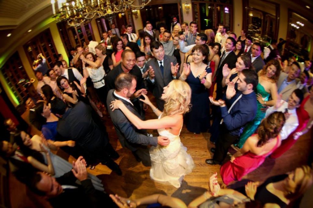 This bride (and groom) are in the center of the action with friends and family enjoyng their first dance as husband and wife at The Dominion.