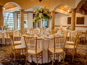 Golden chairs and white tablecloths make this ballroom at The Dominion look so exquisite!