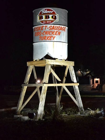 Blanco BBQ water tower by night
