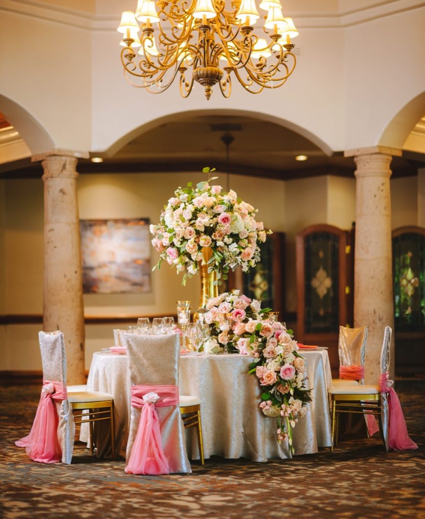 A table overflowing with flowers can be romantic from Events by A Touch of Elegance