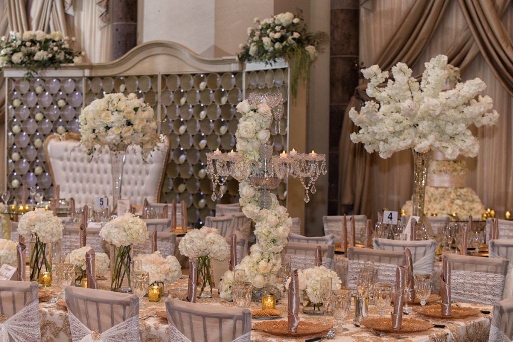 A close-up of The Emporium by Yarlen champagne and white table.
