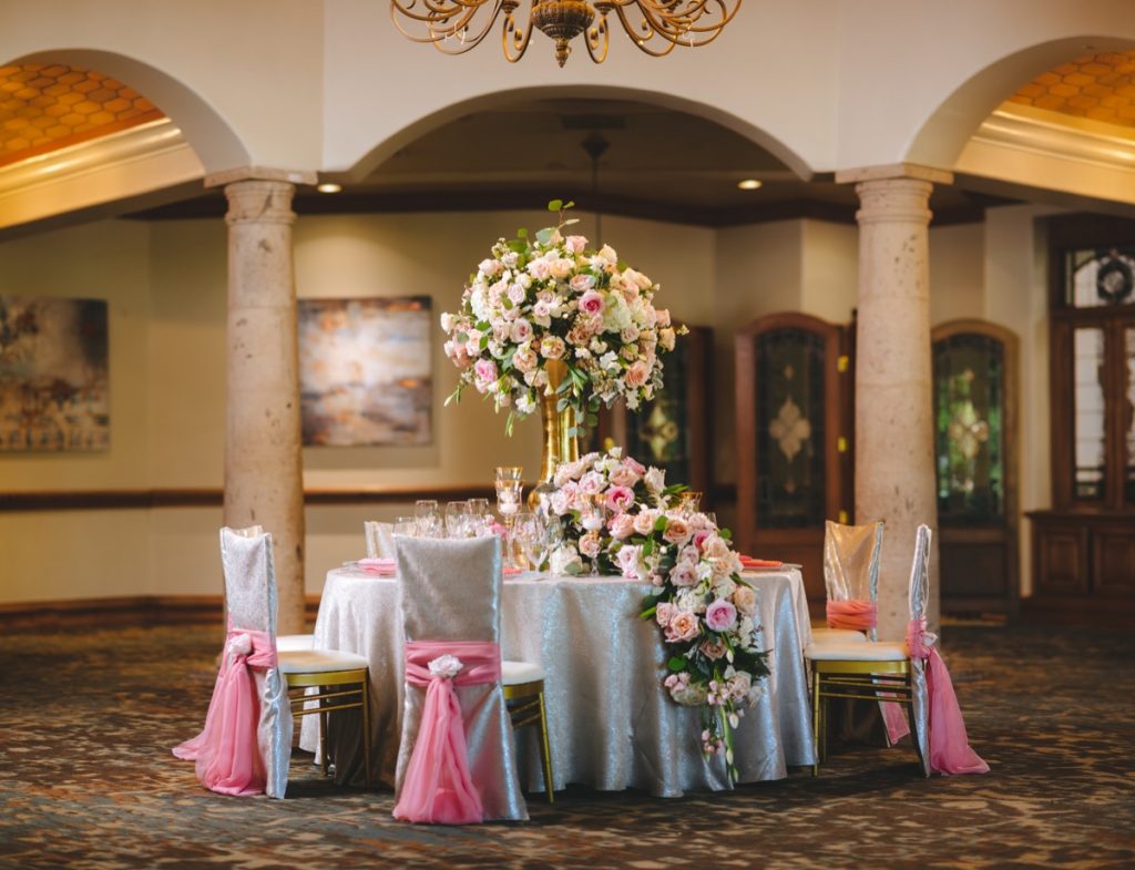 Events by A Touch of Elegance shows that a variety of flowers overflowing from a table can inspire romance!