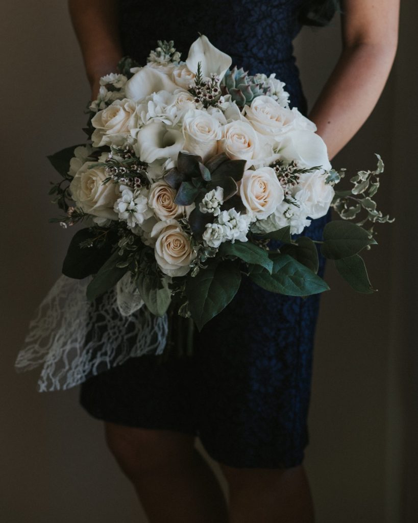 A white rose and lily bouquet from Flair Floral