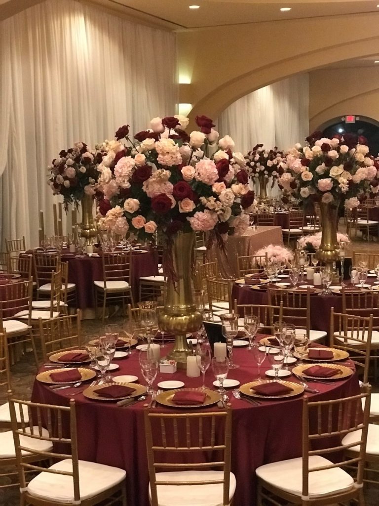 Events by A Touch of Elegance dessed up this banquet by showcasing red and blush roses