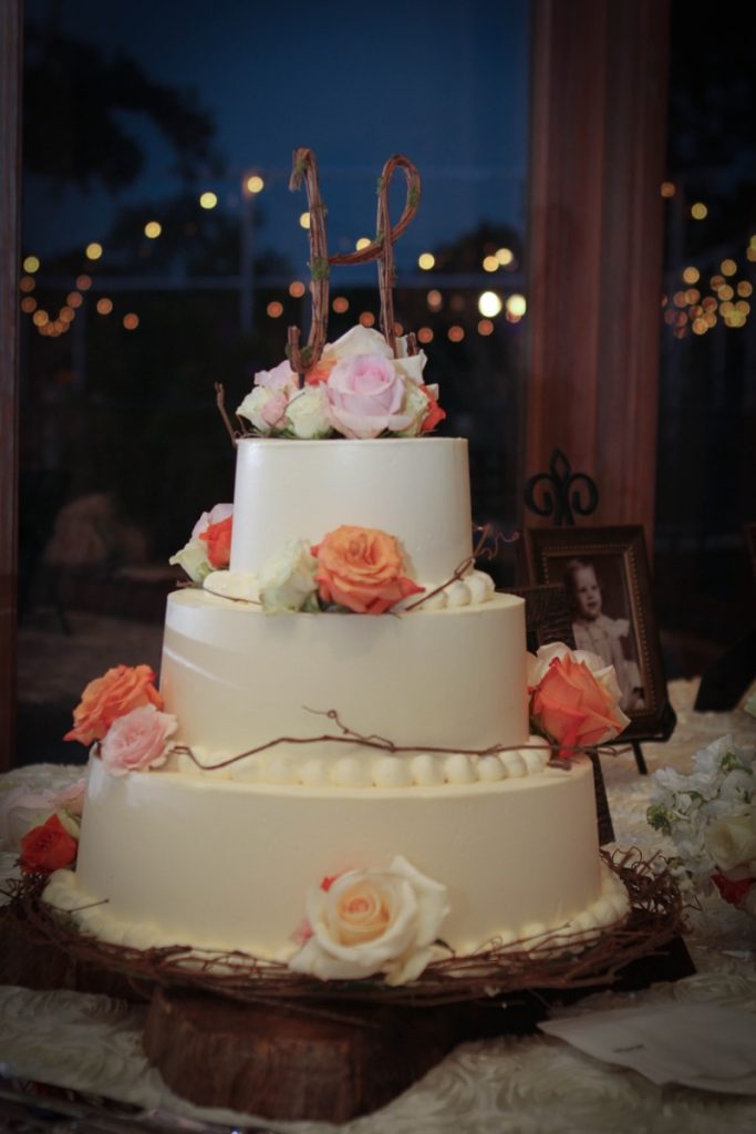 Cake! Mmmmmm. So tasty and three layers of cake! with orange and blush roses!