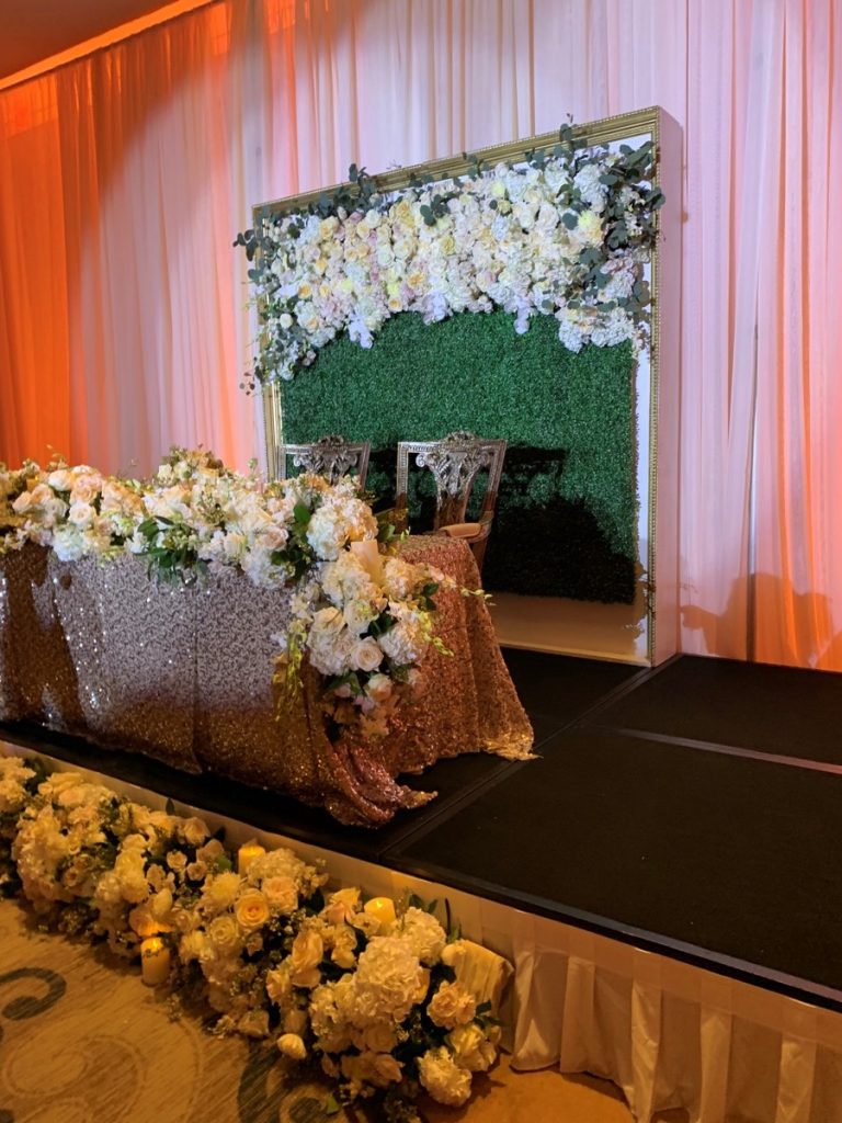 The florals by Events by Touch of Elegance serve to enhance the entire room.
