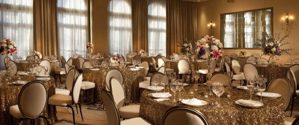 Golden tablecloths and brownish chairs looks wonderful in this banquet shot at The Eilan Hotel Resort and Spa.
