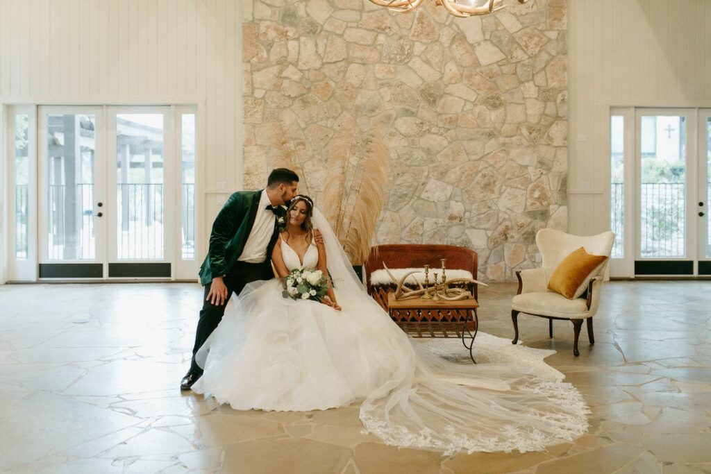 Imagine a golden sunset over a crystal blue lake with the lush, rolling hills of South Texas in the background. Now imagine yourself saying “I do,” to the love of your life amid this picturesque setting, surrounded by family and friends. Nestled in the Texas Hill Country, Sendera Springs wedding venue is 56 acres of natural beauty. From its breathtaking outdoor vistas to the spacious interior with its stone and wood accents, it’s the stuff that Texas bridal dreams are made of. “Our venue is for the bride who is looking for an authentic Hill Country wedding,” says Hannah Plucheck, venue manager. “It’s got that rustic, elegant charm.”