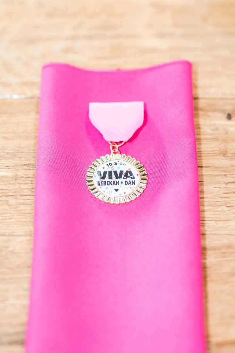 pink napkin with custome viva fiesta medals