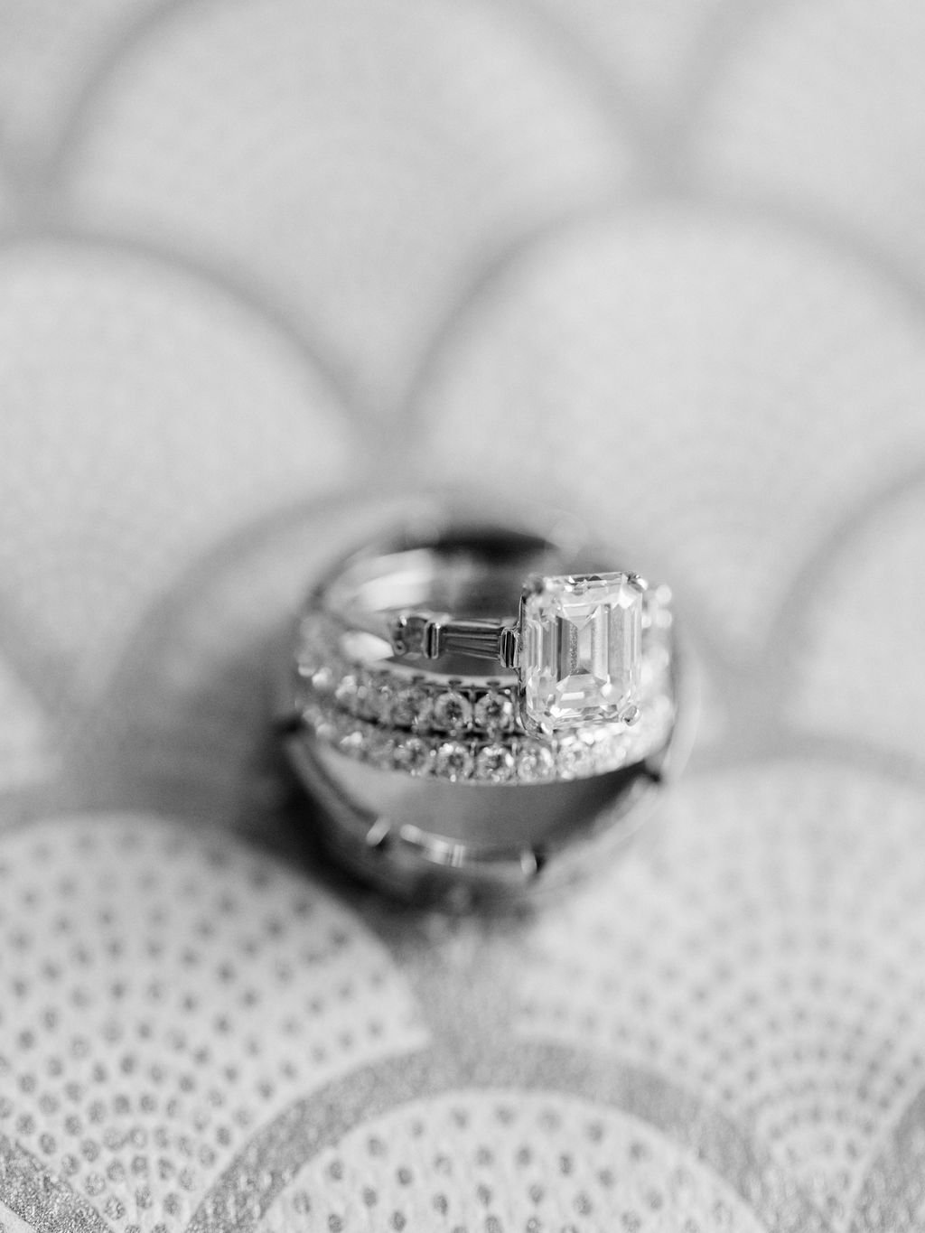 black and white photo of wedding rings at st Anthony hotel