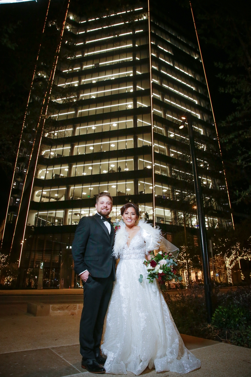 San Antonio Weddings couple, Dax and Yumi, at Frost Tower Dos Kiwis