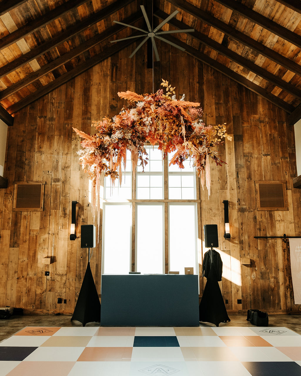 colorful dance floor with hanging floral installation