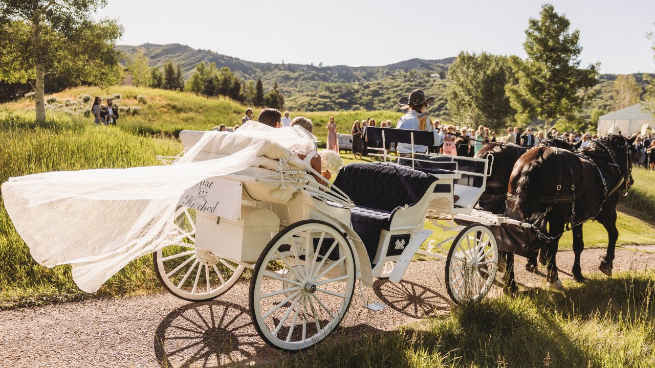 wedding exit on horse drawn carriage in Snowmass Colorado
